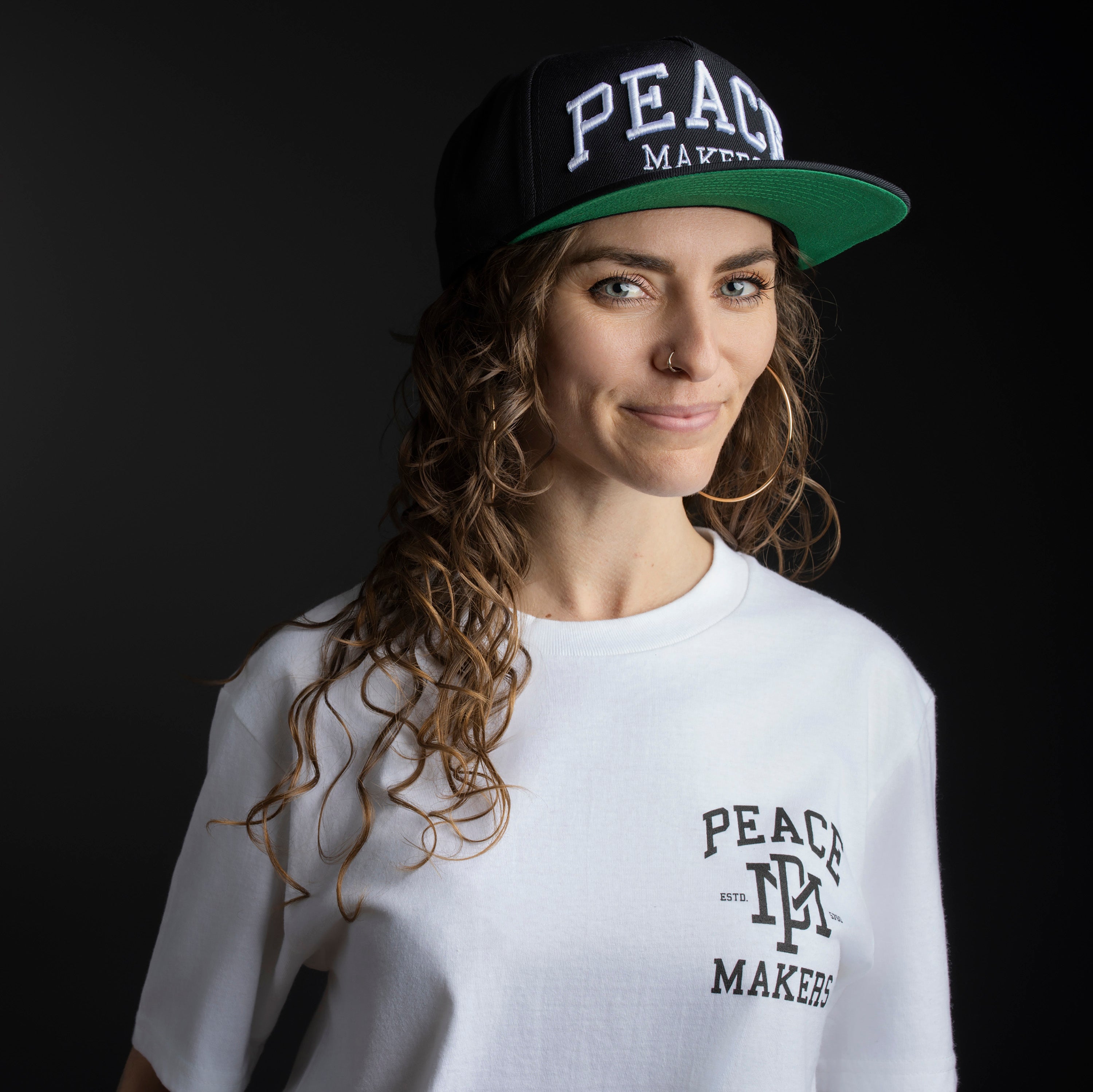 Our Peace Makers Hat is a statement of unity, purpose, and style. This Premium Five-Panel Snapback Cap is built on a classic Yupoong 5-panel pinch front, offering a timeless fit that suits most head sizes comfortably. Whether you're repping peace on the streets or just adding a clean, versatile piece to your wardrobe, this hat delivers.
Pair it with our Peace Makers Tees, Hoodies, and Sweats for the ultimate look—because spreading peace isn’t just a mindset, it’s a movement.