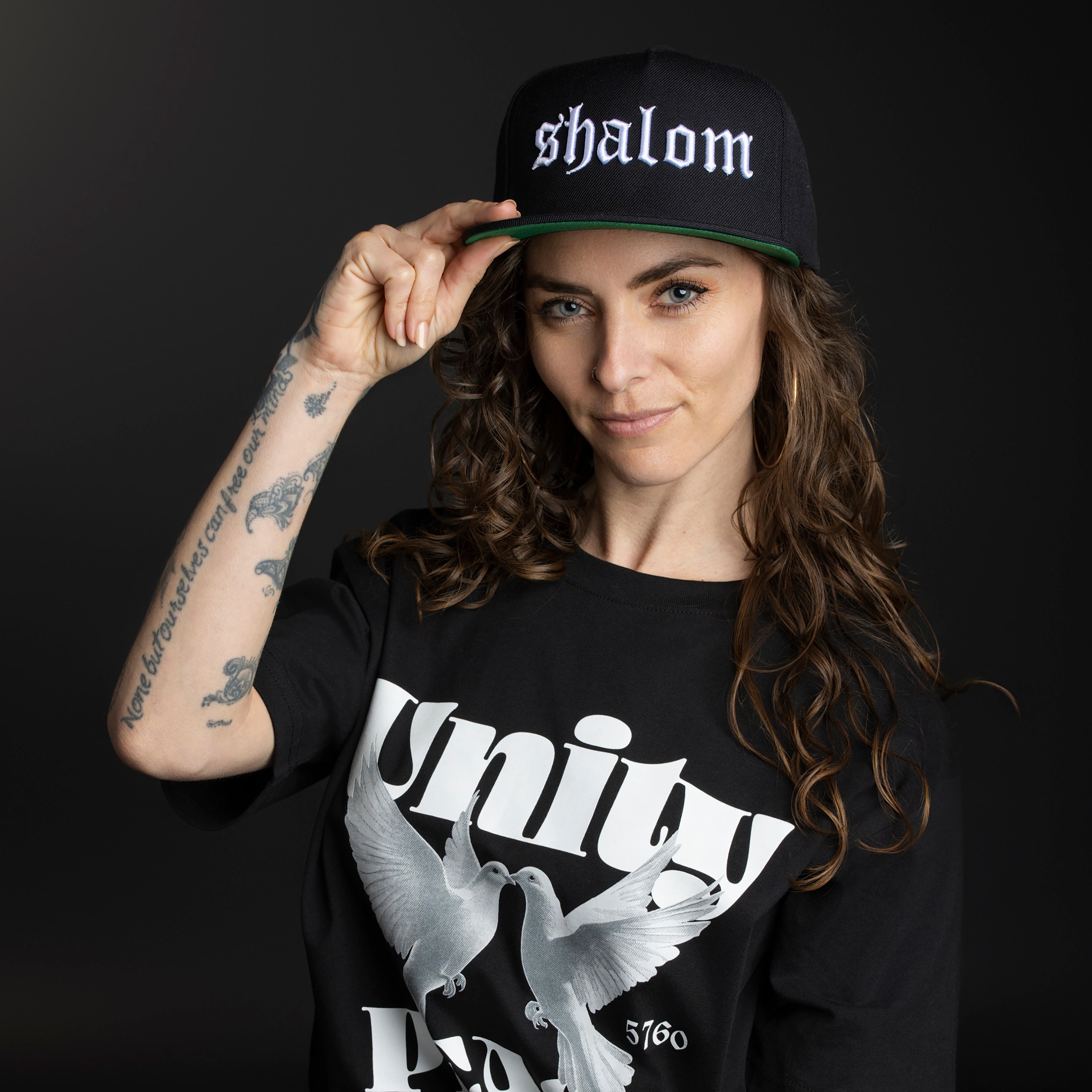 The Peace & Unity Hat is a symbol of connection, strength, and style. This Premium Five-Panel Snapback Cap is built on a classic Yupoong 5-panel pinch front, offering a perfect fit for most head sizes. Designed for those who stand for peace and togetherness, it’s the ideal everyday essential.
Pair it with our Peace & Unity Tees, Hoodies, and Definition Sweats for a complete look that spreads the message—because unity starts with you.