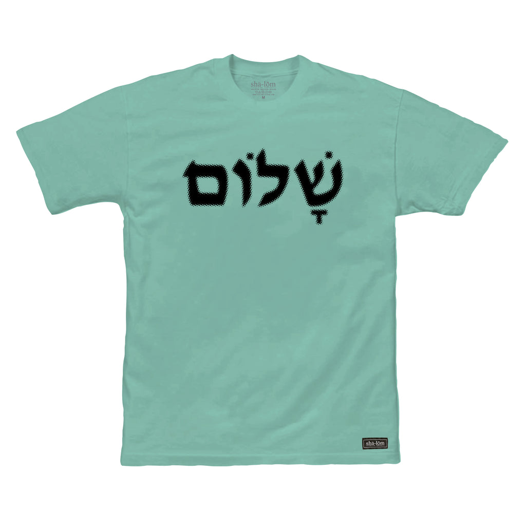 100% Ringspun Cotton Tee with shalom in Hebrew. Hand screen printed in Santa Cruz CA with eco friendly water base inks. Custom shalom definition neck tag and shalom definition woven label sewn on the bottom left corner. Wear this garment in peace. Shalom Peace Every-Wear.