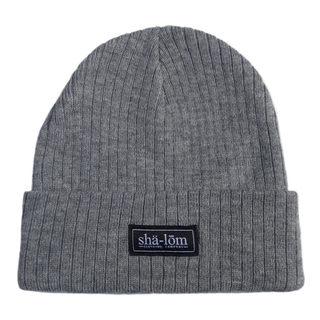 50/50 Recycled polyester/acrylic Beanie with our Shalom Definition woven label. This beanie is super soft and will keep your head warm. One size fits most.      50/50 Recycled polyester/acrylic     Narrow rib knit     11” knit with cuff     Woven label     Global Sustainable Recycled Standard