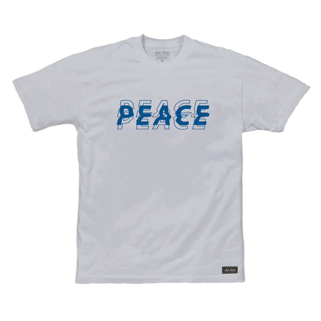 Our WIGGLE shirt is a fun trippy peace graphic. 100% Cotton Hand screen printed in Santa Cruz CA with eco friendly water base inks. Custom shalom definition neck tag and shalom definition woven label sewn on the bottom left corner. Wear this garment in peace. Shalom Peace Every-Wear. 